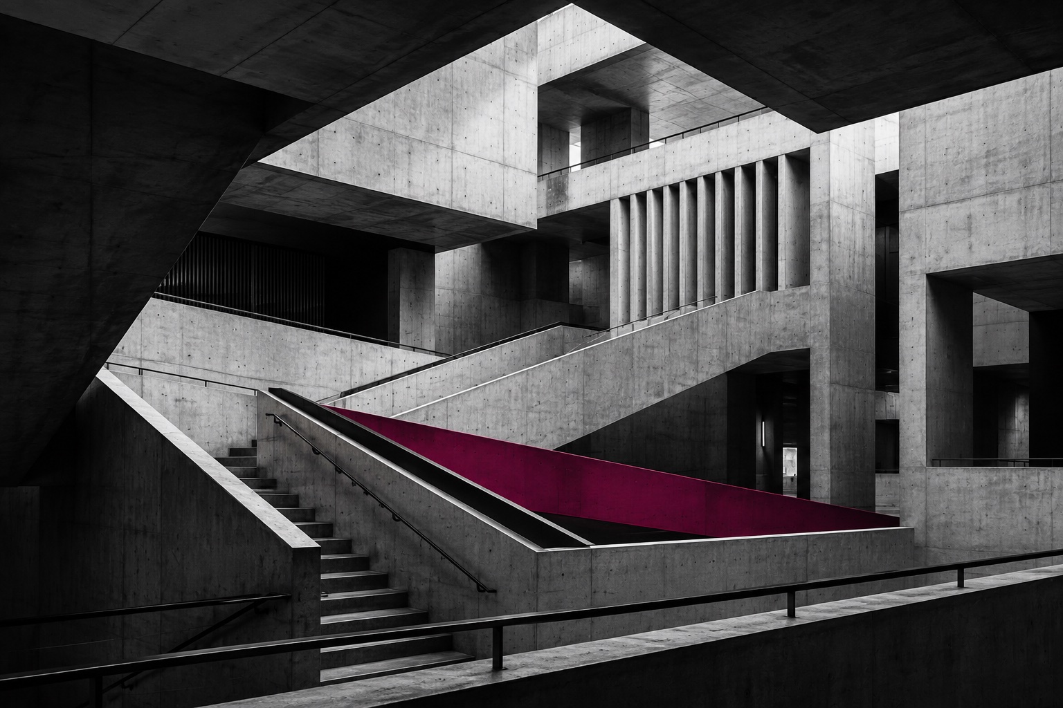 Minimal concrete architecture with a single magenta structural element